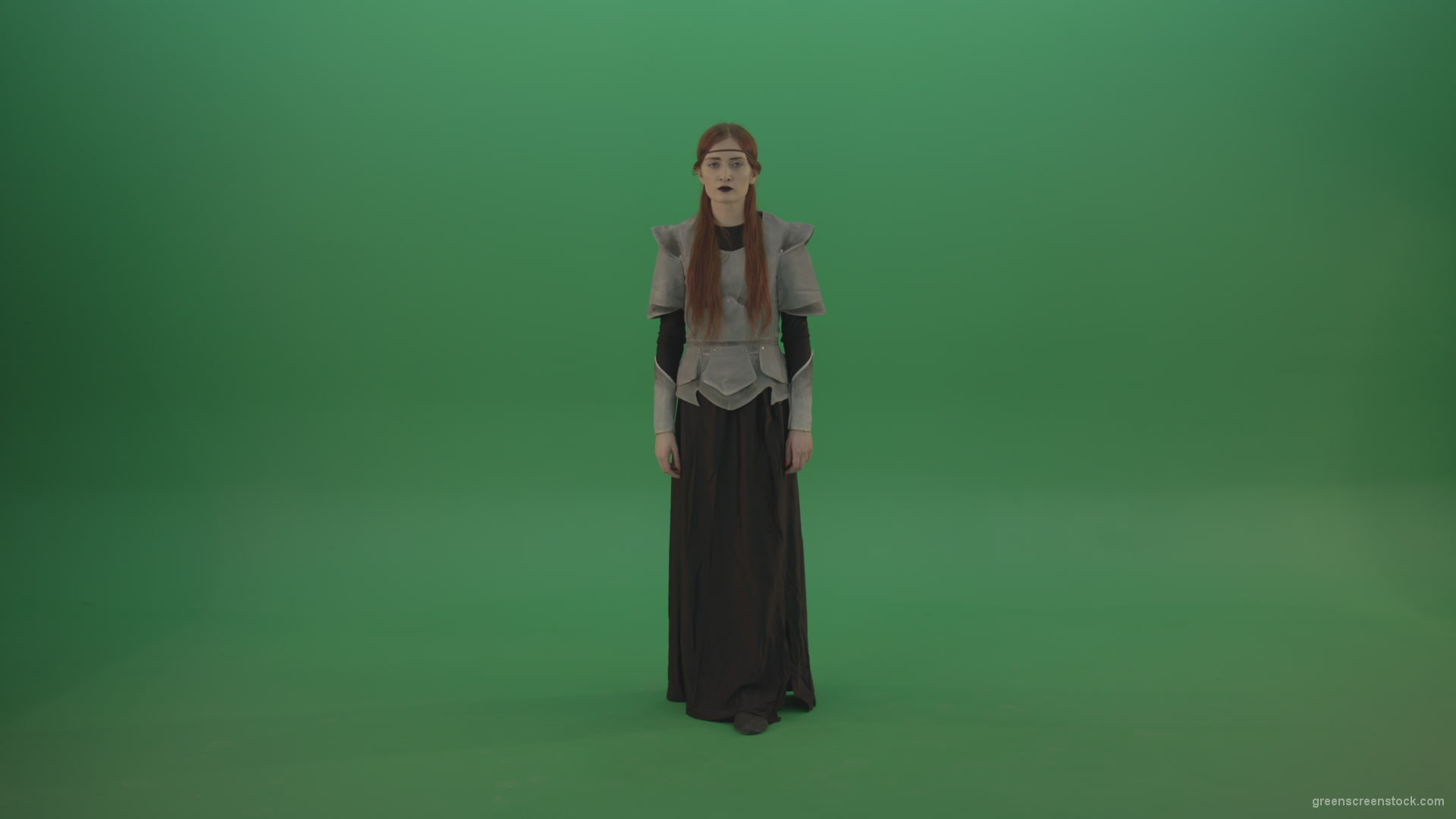 Redheaded-girl-in-full-height-in-medieval-warrior-clothing-asks-for-help-from-the-gods-on-green-screen_001 Green Screen Stock