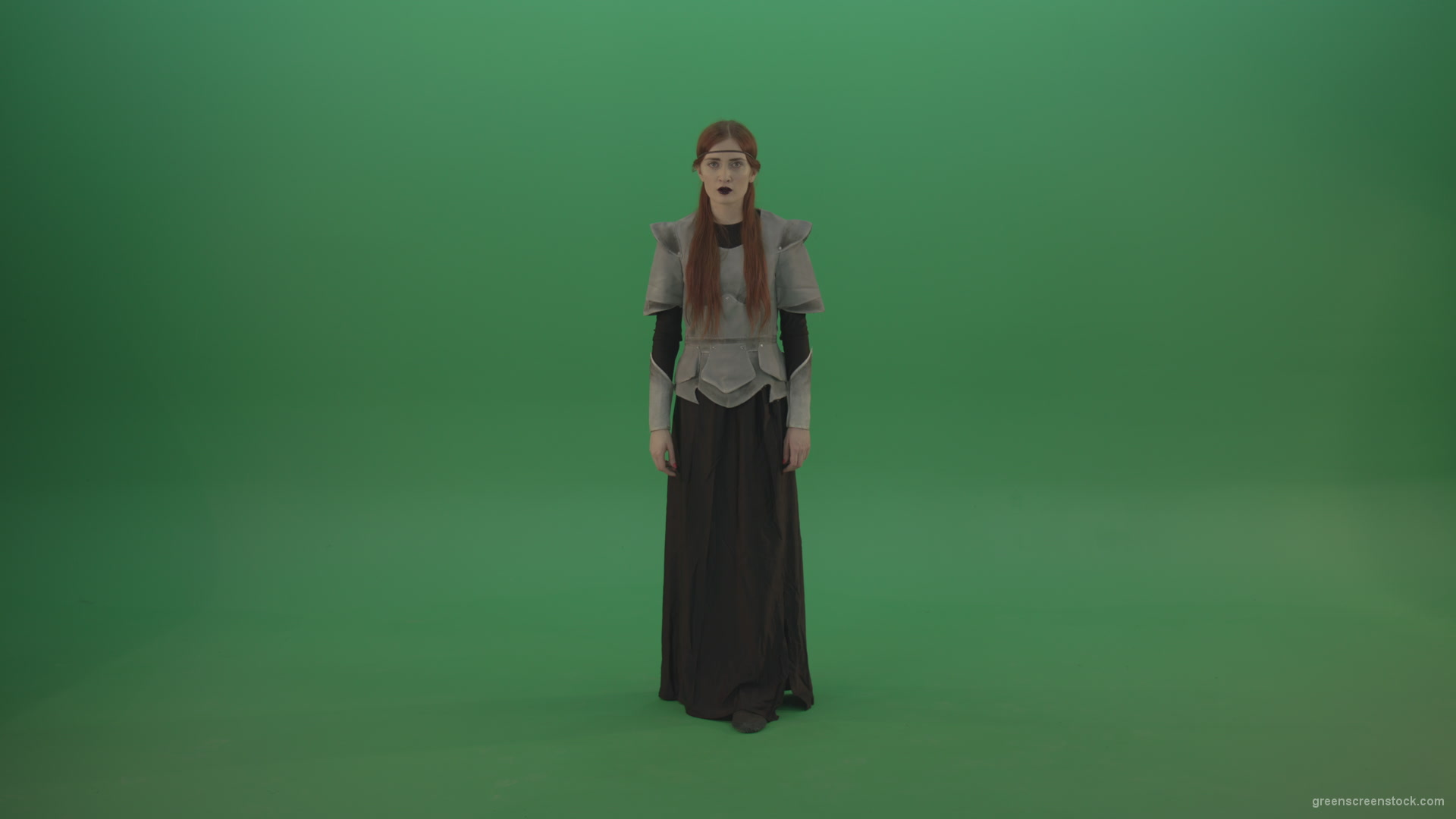 Redheaded-girl-in-full-height-in-medieval-warrior-clothing-asks-for-help-from-the-gods-on-green-screen_002 Green Screen Stock