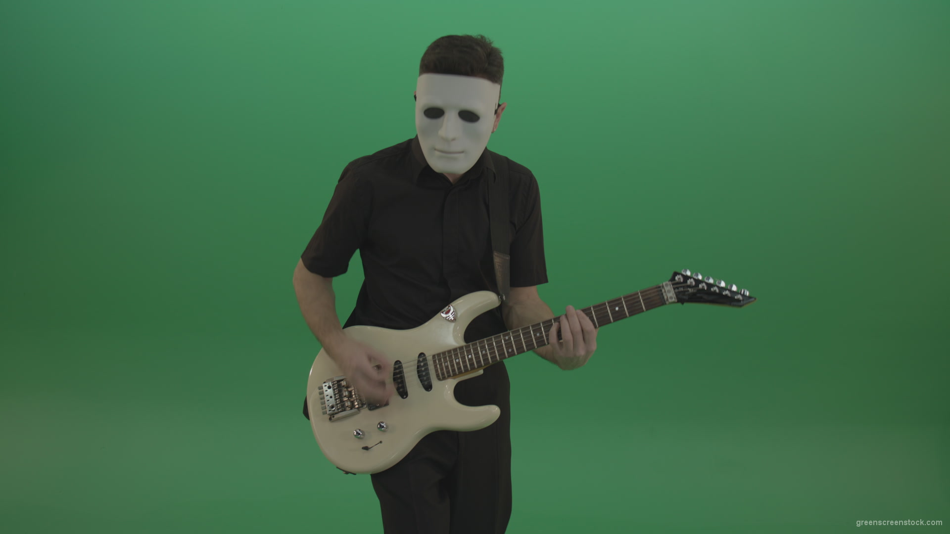 Rock-man-in-white-mask-and-black-wear-playing-guitar-isolated-on-green-screen-in-front-view_009 Green Screen Stock