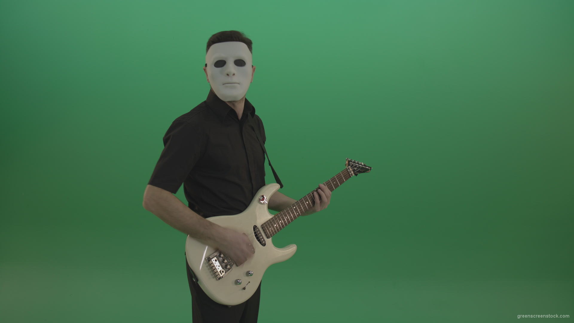Rock-man-in-white-mask-and-black-wear-playing-guitar-isolated-on-green-screen-in-side-view_009 Green Screen Stock