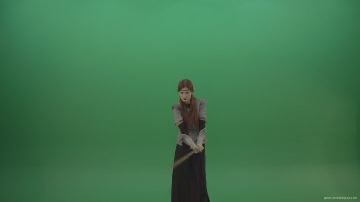 vj video background Swinging-on-a-green-background-with-a-sword-the-girl-gracefully-shows-her-strength_003