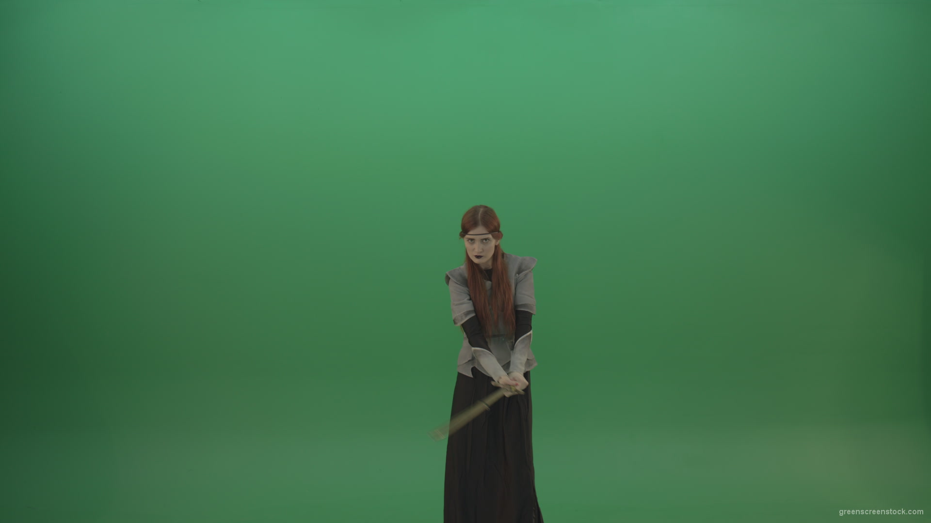 vj video background Swinging-on-a-green-background-with-a-sword-the-girl-gracefully-shows-her-strength_003