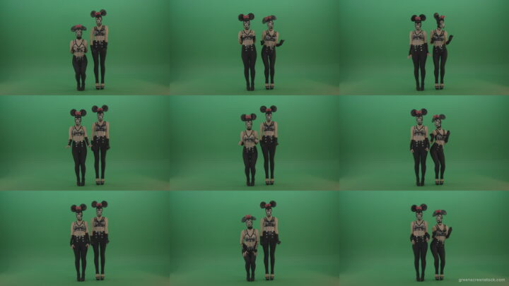 Two-girls-dressed-in-Mickey-Mouse-sit-squarelyon-green-screen Green Screen Stock