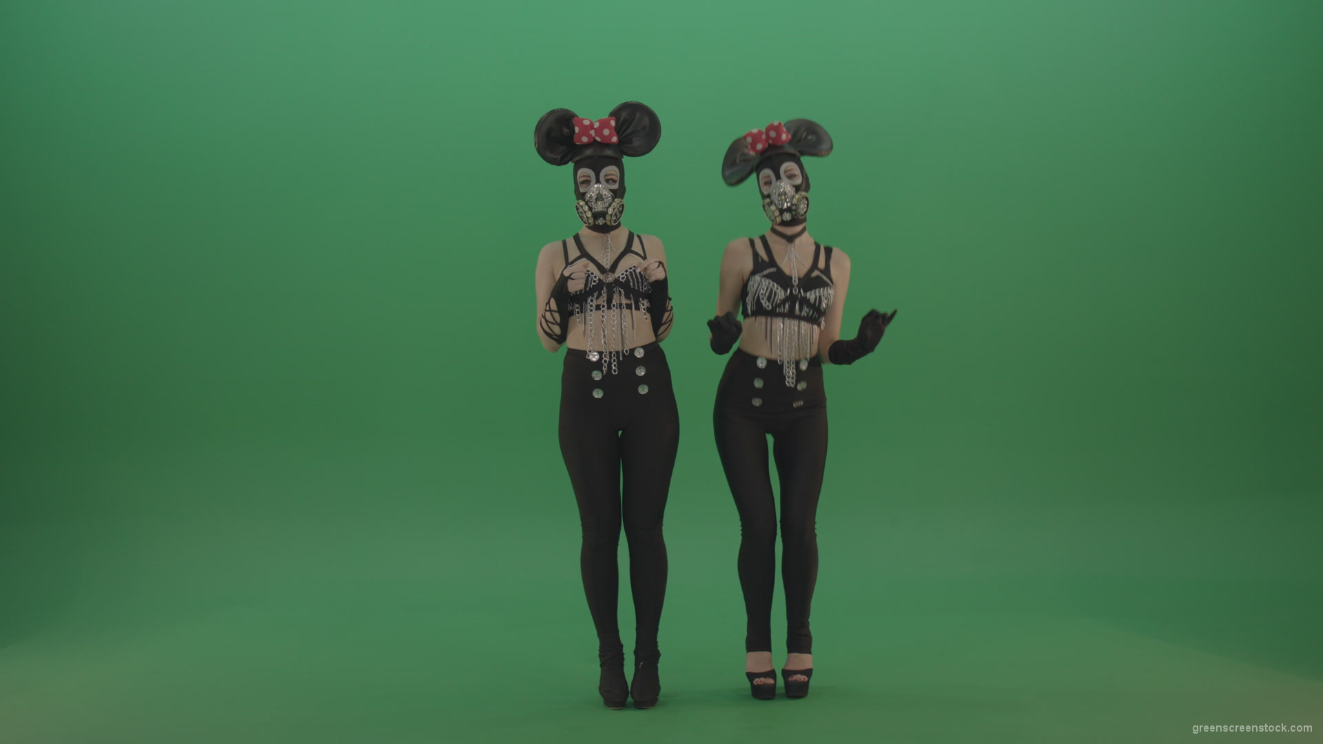 Two-girls-dressed-in-Mickey-Mouse-sit-squarelyon-green-screen_002 Green Screen Stock