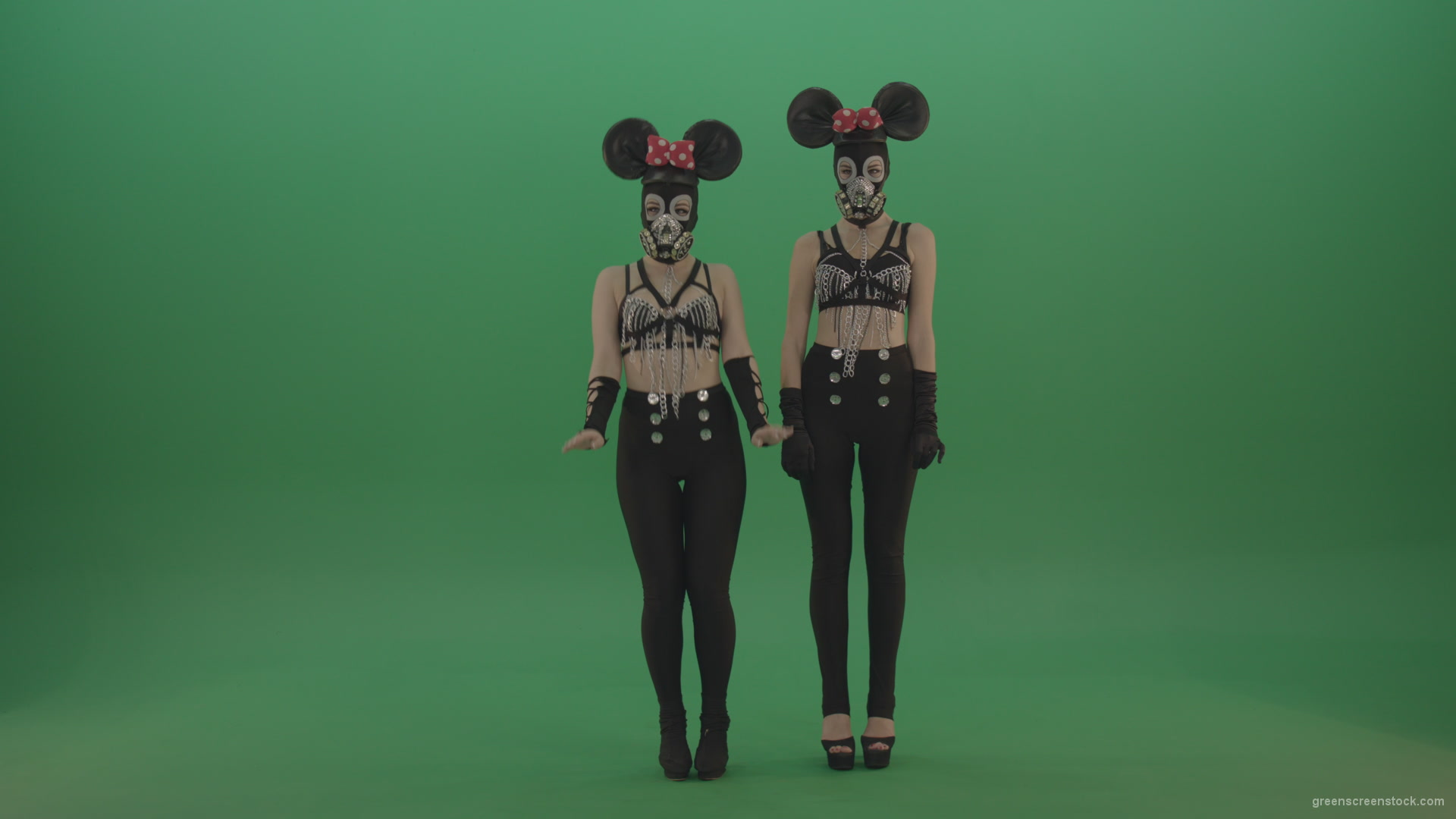 Two-girls-dressed-in-Mickey-Mouse-sit-squarelyon-green-screen_004 Green Screen Stock