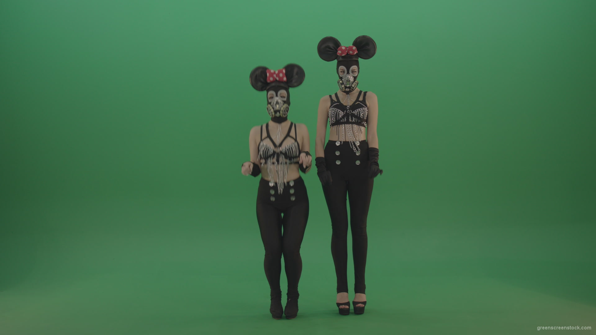 Two-girls-dressed-in-Mickey-Mouse-sit-squarelyon-green-screen_005 Green Screen Stock