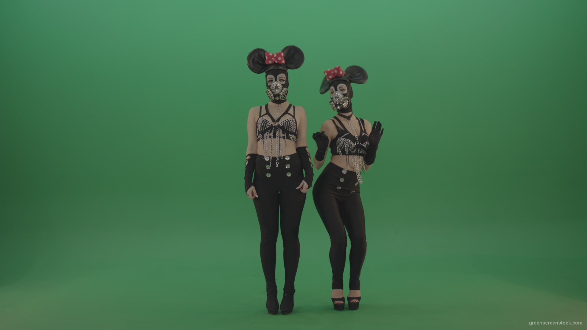 Two-girls-dressed-in-Mickey-Mouse-sit-squarelyon-green-screen_006 Green Screen Stock