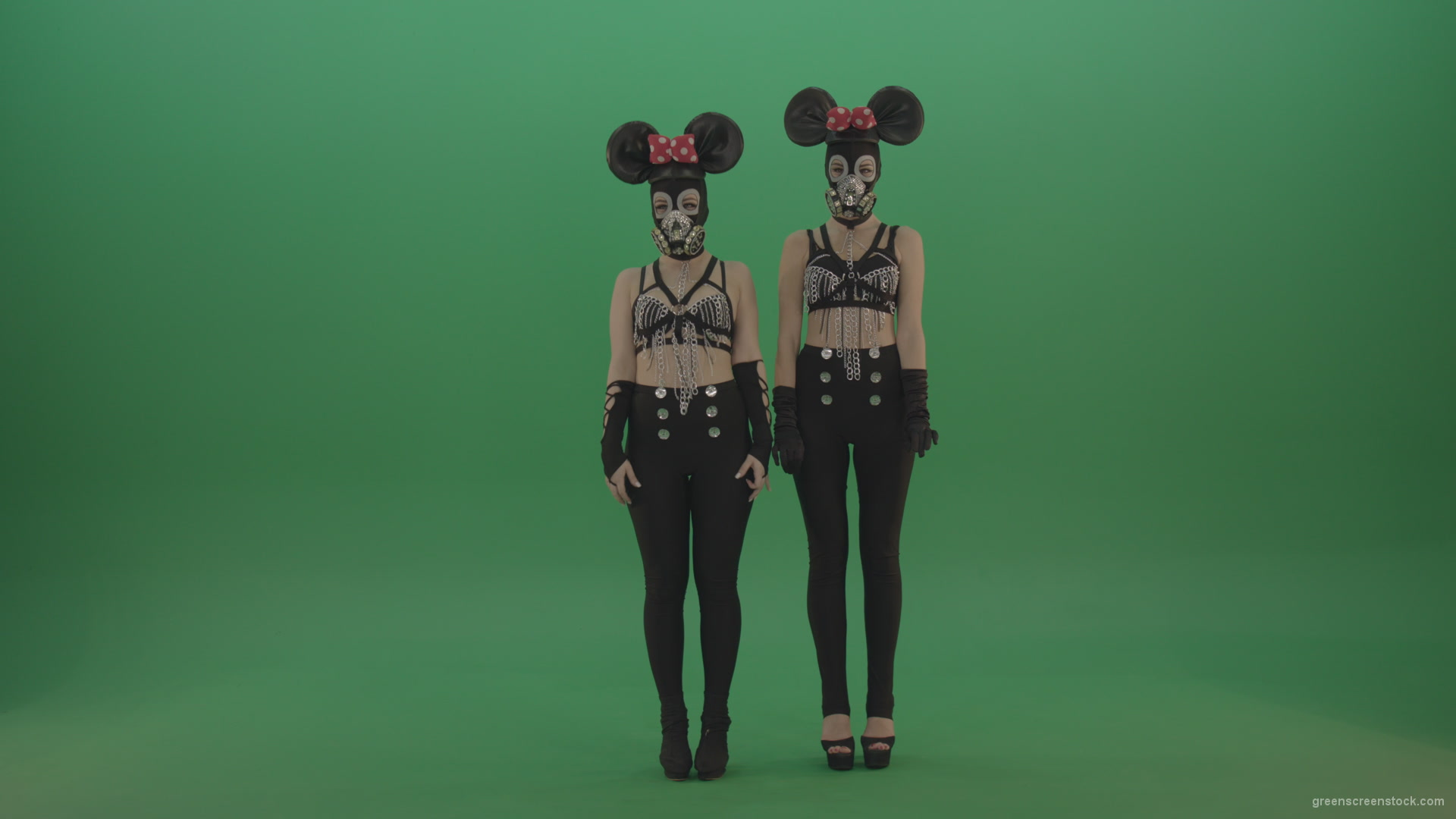 Two-girls-dressed-in-Mickey-Mouse-sit-squarelyon-green-screen_007 Green Screen Stock