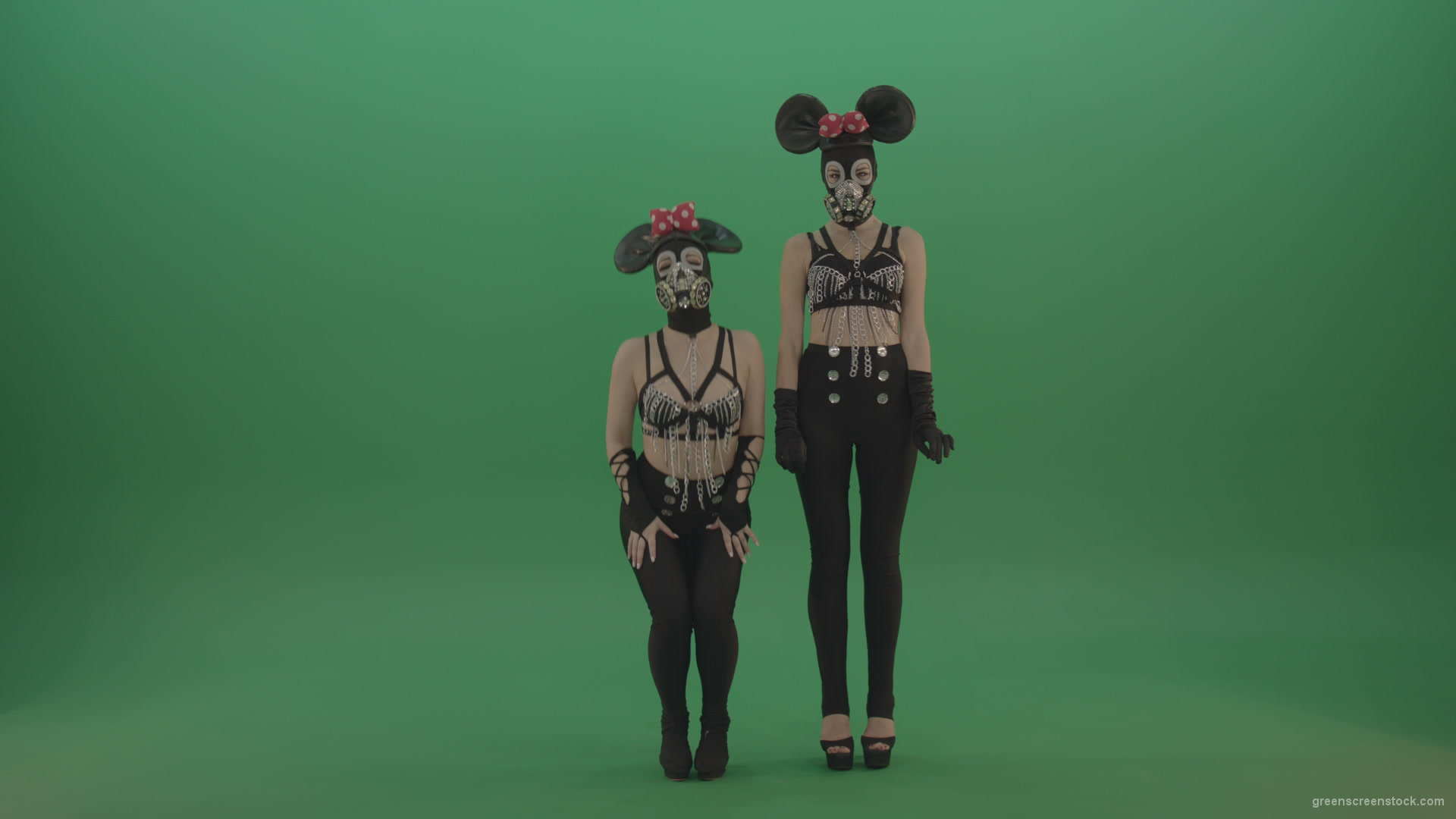 Two-girls-dressed-in-Mickey-Mouse-sit-squarelyon-green-screen_008 Green Screen Stock