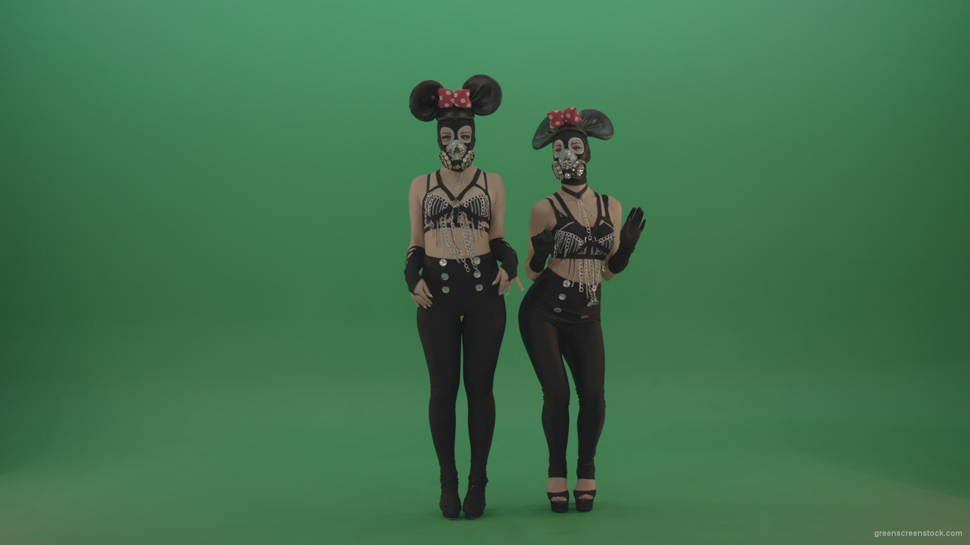 Two-girls-dressed-in-Mickey-Mouse-sit-squarelyon-green-screen_009 Green Screen Stock