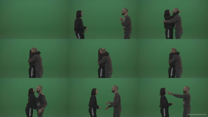 Two-people-in-black-and-grey-wear-hug-and-kiss-each-other-over-chromakey-background Green Screen Stock