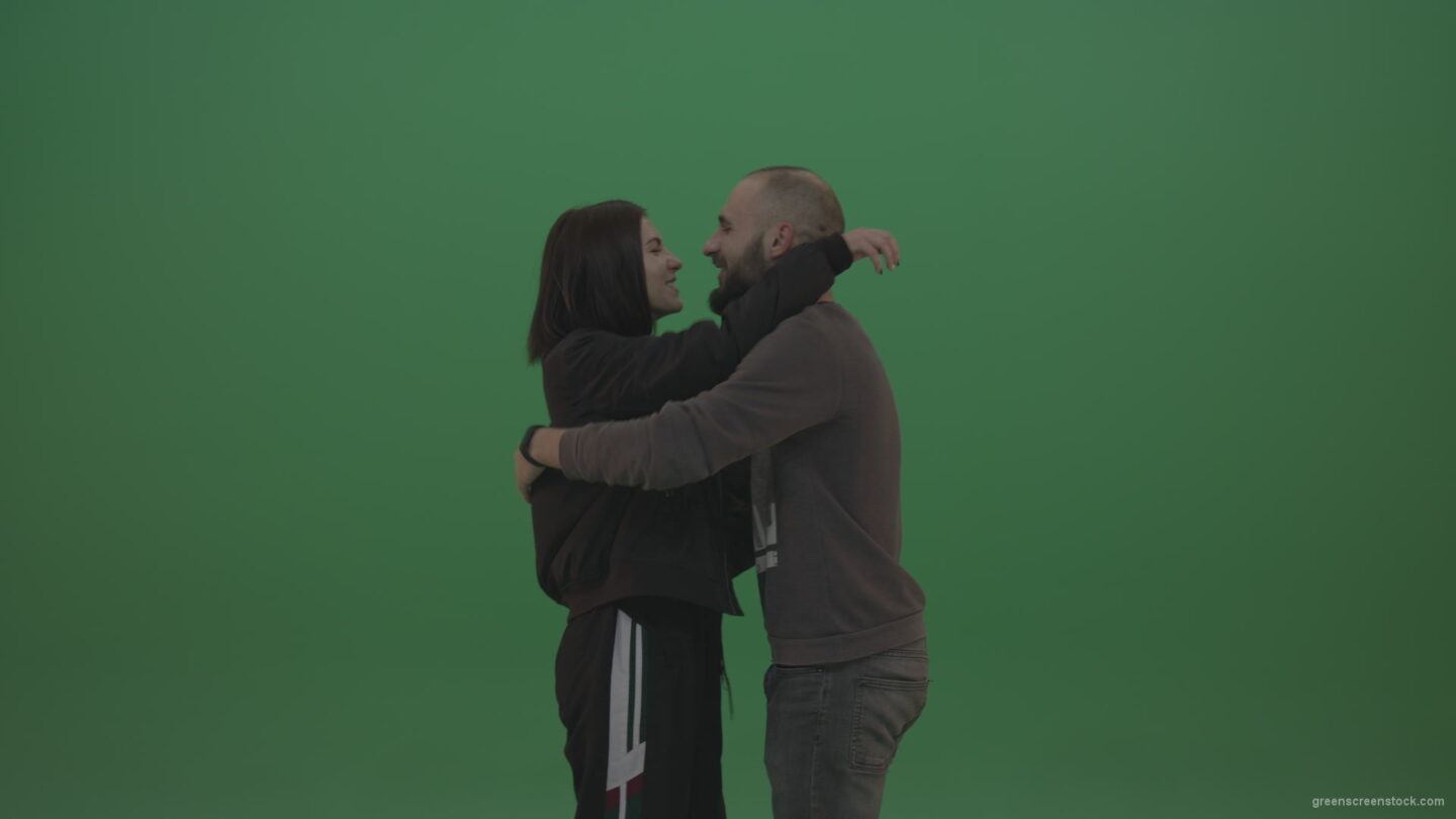 vj video background Two-people-in-black-and-grey-wear-hug-and-kiss-each-other-over-chromakey-background_003