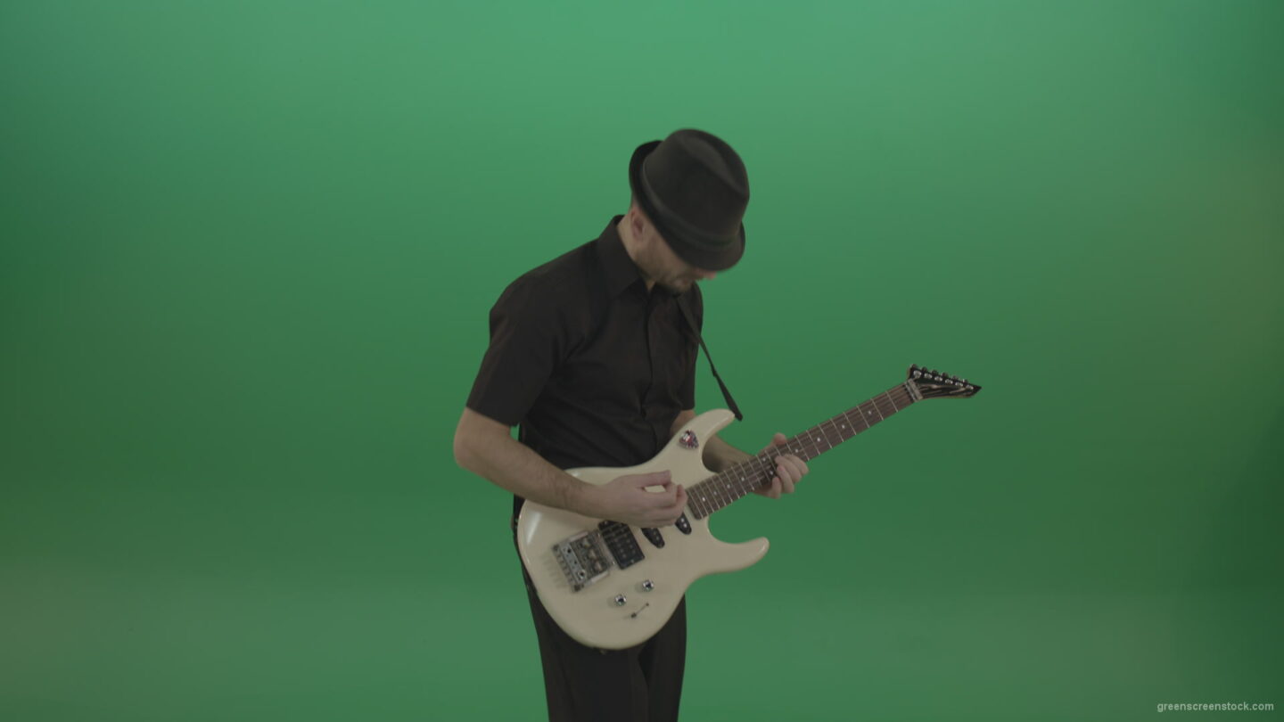 vj video background Virtuoso-guitarist-in-black-costume-and-hat-playing-solo-on-white-electro-guitar-siolated-on-green-screen_003