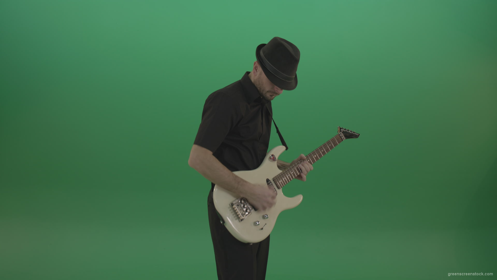 Virtuoso-guitarist-in-black-costume-and-hat-playing-solo-on-white-electro-guitar-siolated-on-green-screen_006 Green Screen Stock