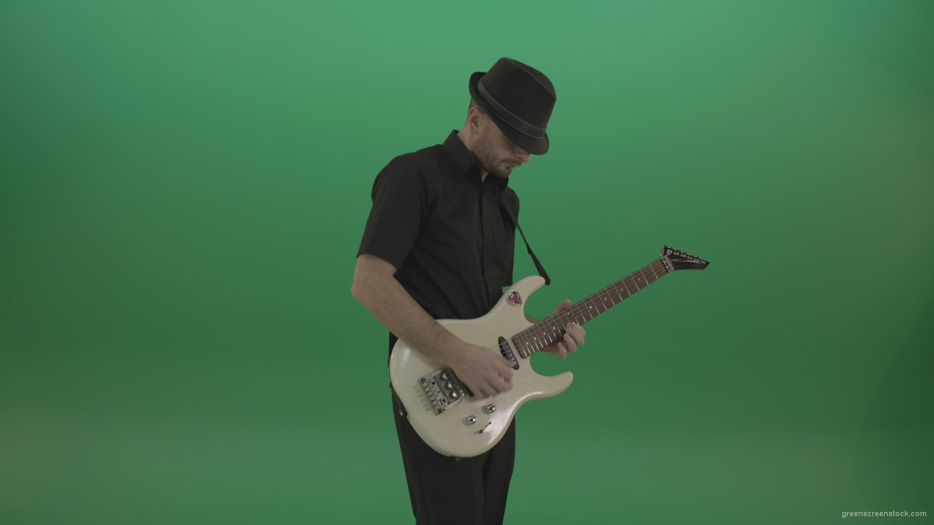 Virtuoso-guitarist-in-black-costume-and-hat-playing-solo-on-white-electro-guitar-siolated-on-green-screen_007 Green Screen Stock