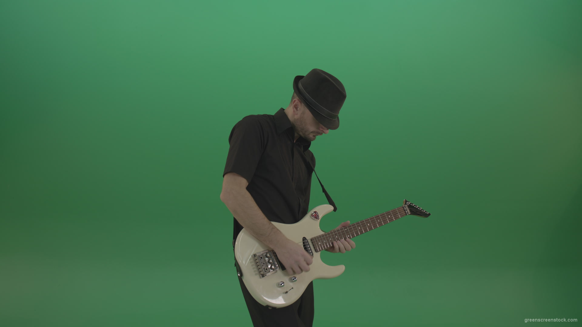 Virtuoso-guitarist-in-black-costume-and-hat-playing-solo-on-white-electro-guitar-siolated-on-green-screen_008 Green Screen Stock