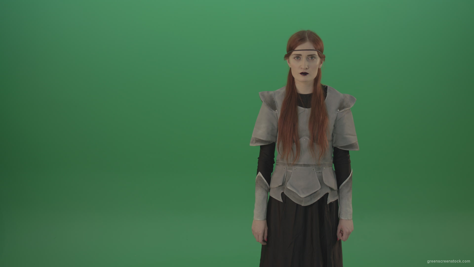 Witch-girl-watched-and-screamed-at-the-camera-with-green-eyes-on-a-green-background_001 Green Screen Stock