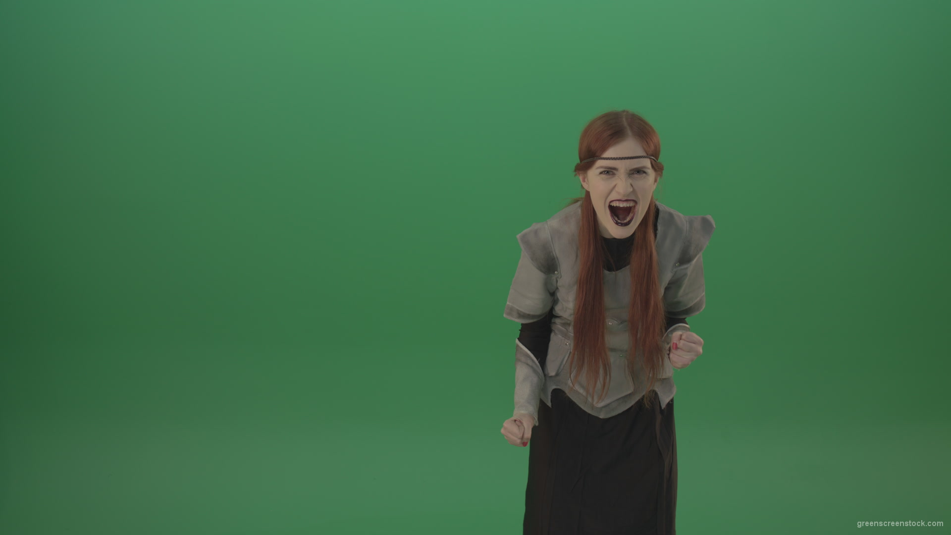 Witch-girl-watched-and-screamed-at-the-camera-with-green-eyes-on-a-green-background_004 Green Screen Stock