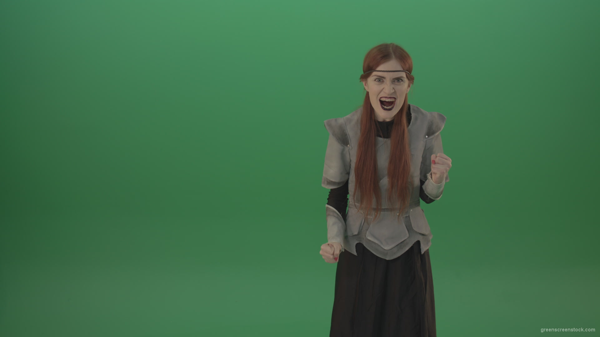 Witch-girl-watched-and-screamed-at-the-camera-with-green-eyes-on-a-green-background_005 Green Screen Stock