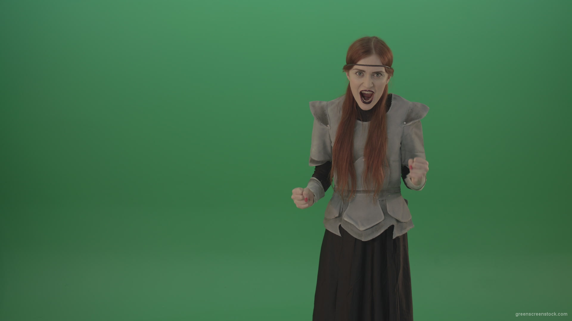 Witch-girl-watched-and-screamed-at-the-camera-with-green-eyes-on-a-green-background_006 Green Screen Stock