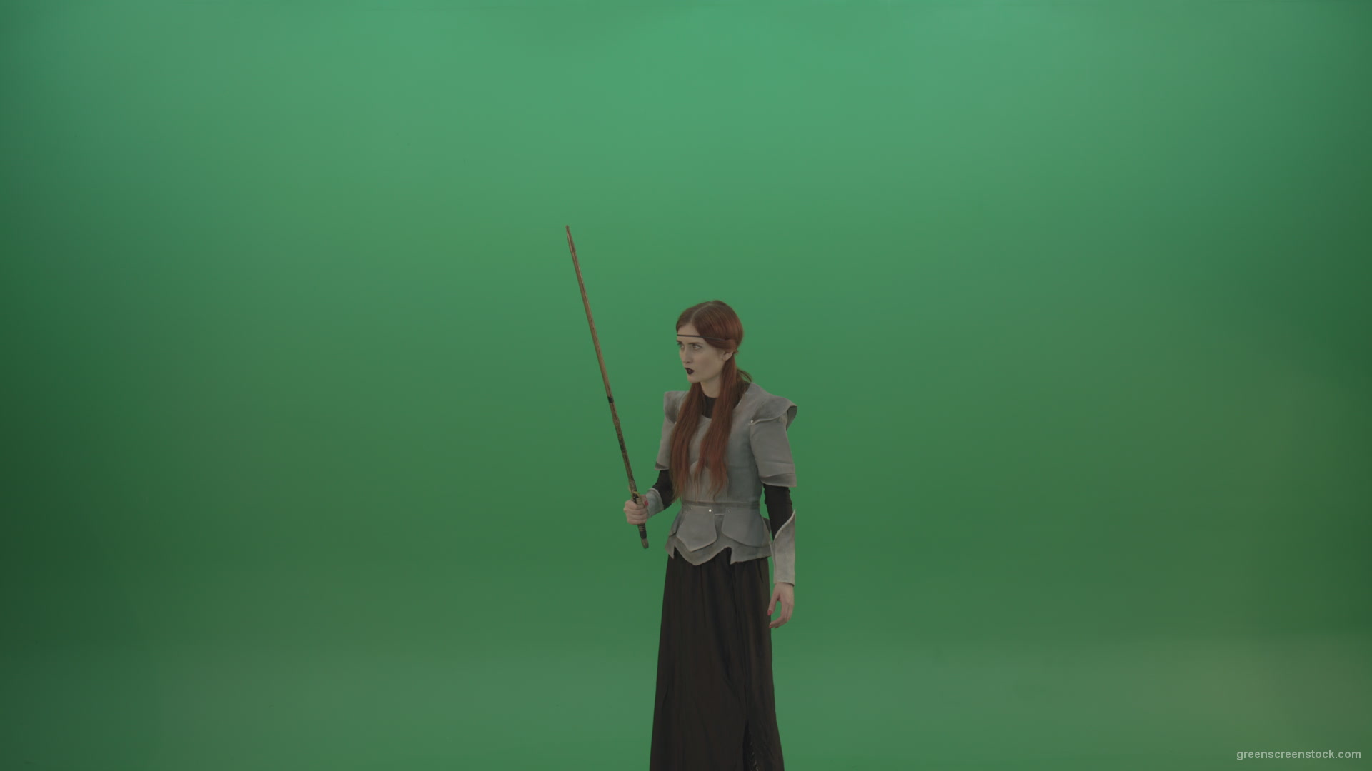 Woman-warrior-holds-a-sword-in-his-hands-makes-an-assault-in-the-attack_001 Green Screen Stock