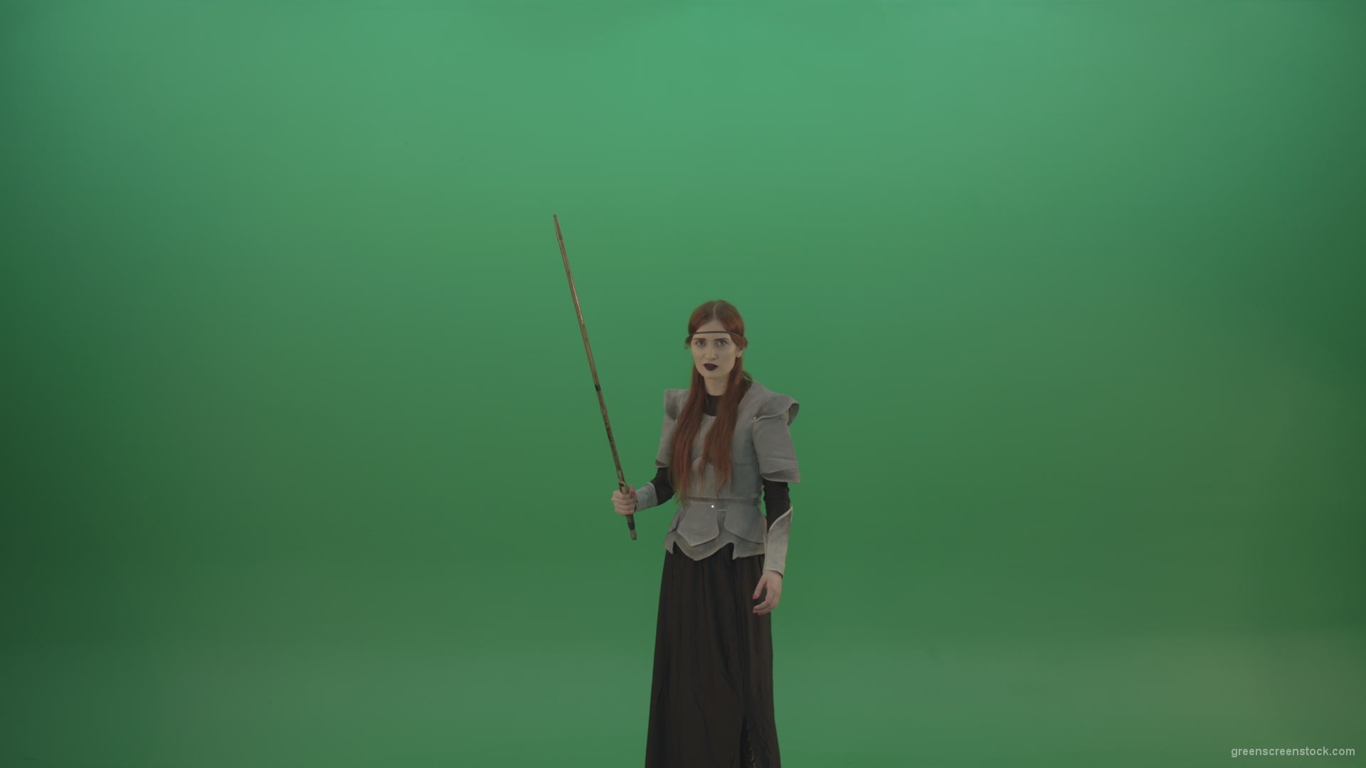 Woman-warrior-holds-a-sword-in-his-hands-makes-an-assault-in-the-attack_005 Green Screen Stock
