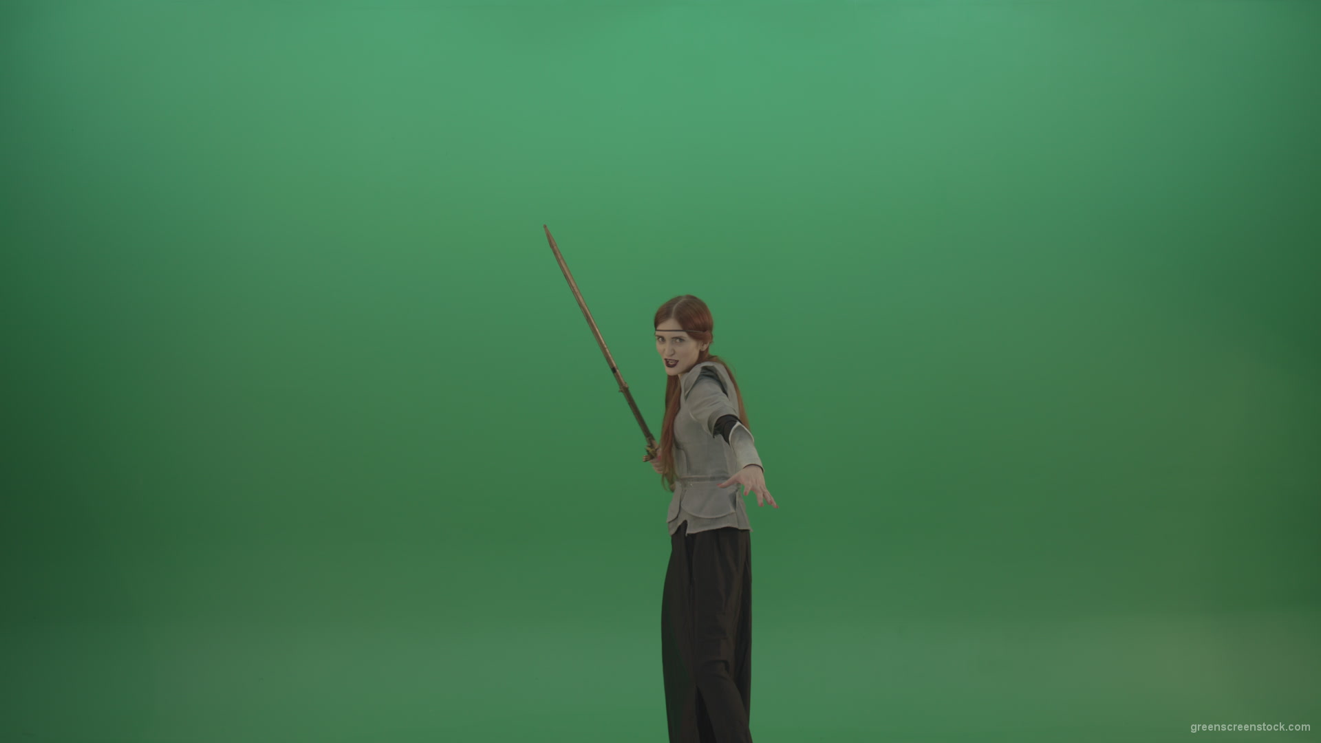 Woman-warrior-holds-a-sword-in-his-hands-makes-an-assault-in-the-attack_006 Green Screen Stock