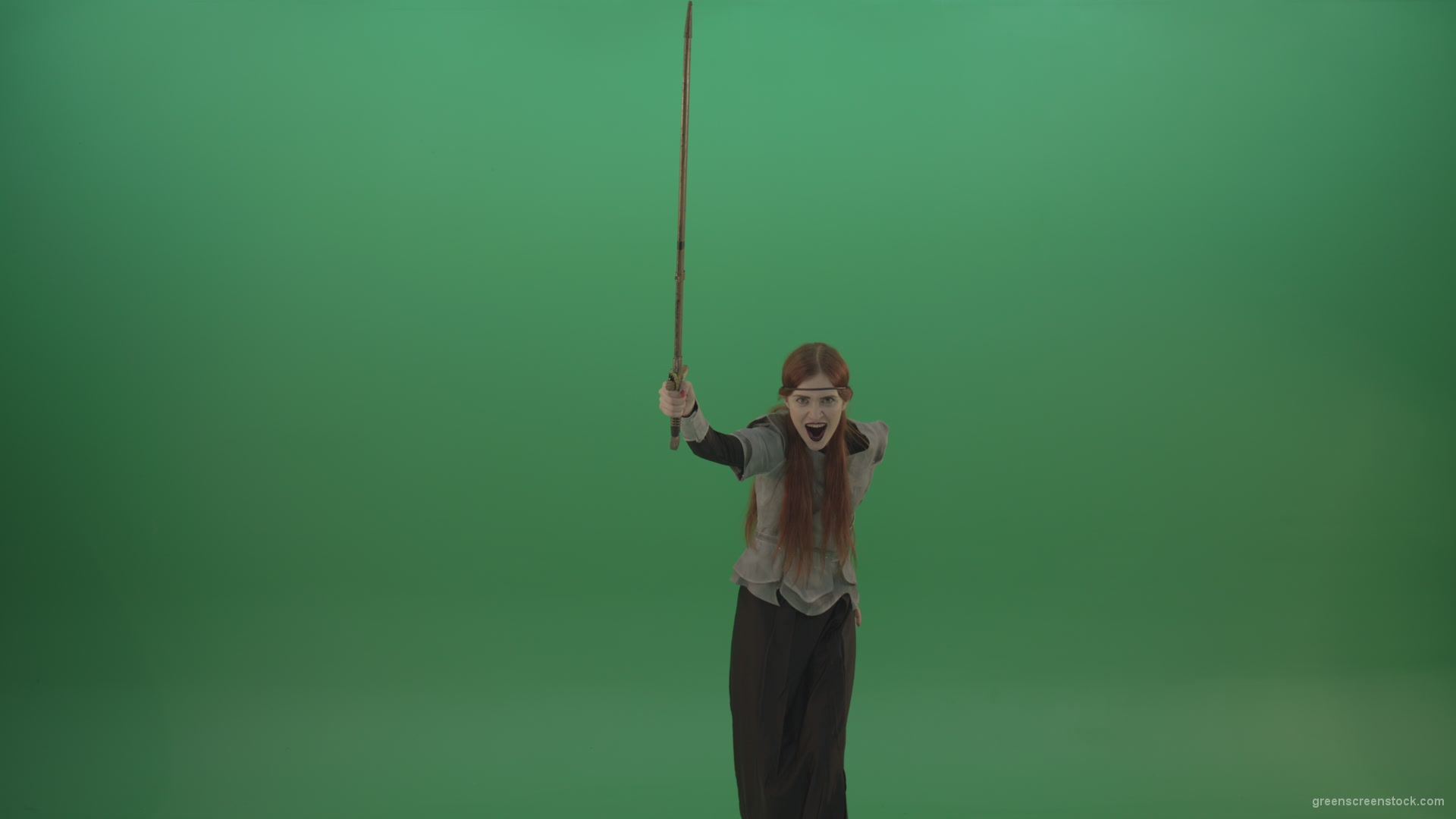 Woman-warrior-holds-a-sword-in-his-hands-makes-an-assault-in-the-attack_009 Green Screen Stock