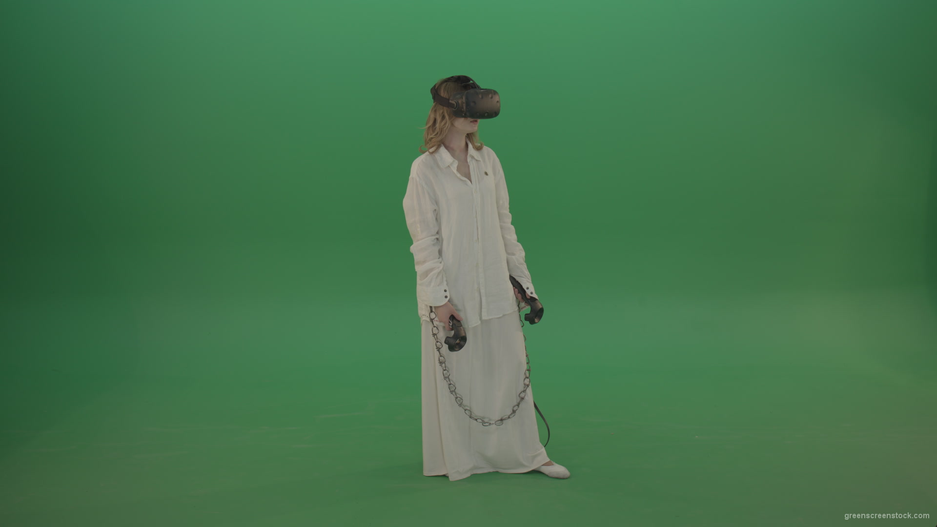 Girl-in-a-white-spacious-dress-is-wearing-glasses-of-virtual-reality-isolated-on-green-background_001 Green Screen Stock