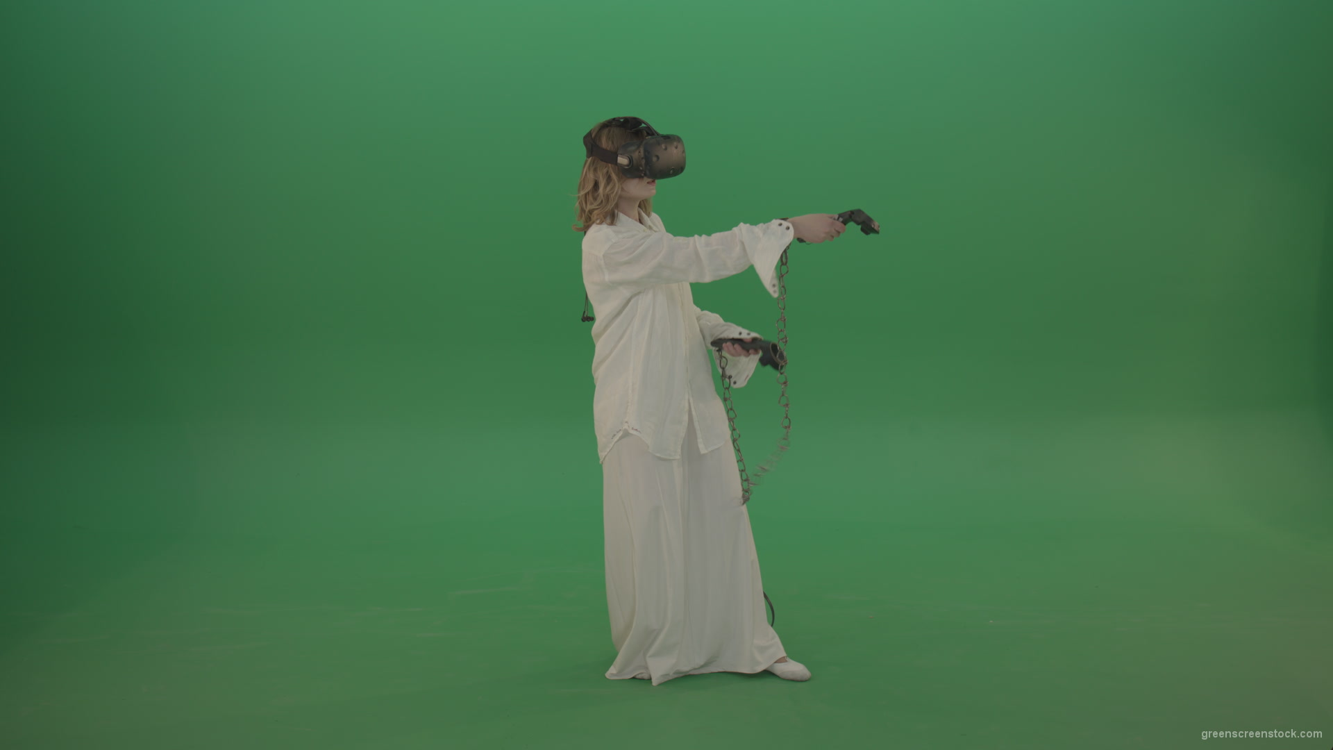 Girl-in-a-white-spacious-dress-is-wearing-glasses-of-virtual-reality-isolated-on-green-background_002 Green Screen Stock