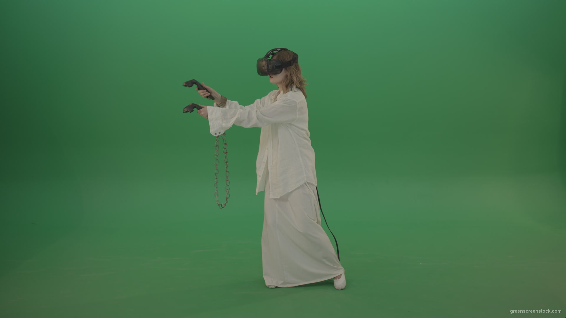 Girl-in-a-white-spacious-dress-is-wearing-glasses-of-virtual-reality-isolated-on-green-background_006 Green Screen Stock