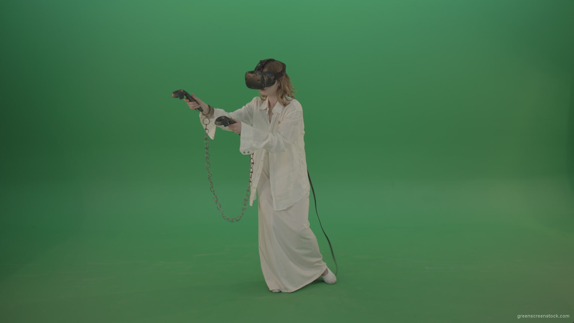 Girl-in-a-white-spacious-dress-is-wearing-glasses-of-virtual-reality-isolated-on-green-background_007 Green Screen Stock