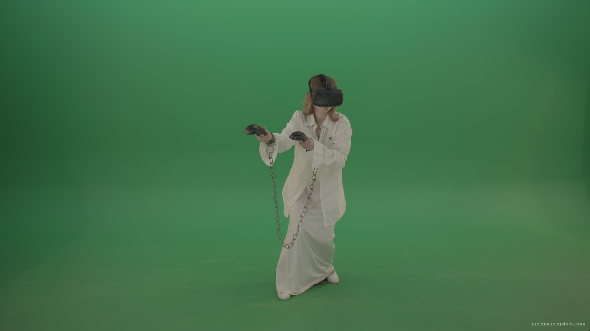 Girl-in-a-white-spacious-dress-is-wearing-glasses-of-virtual-reality-isolated-on-green-background_008 Green Screen Stock