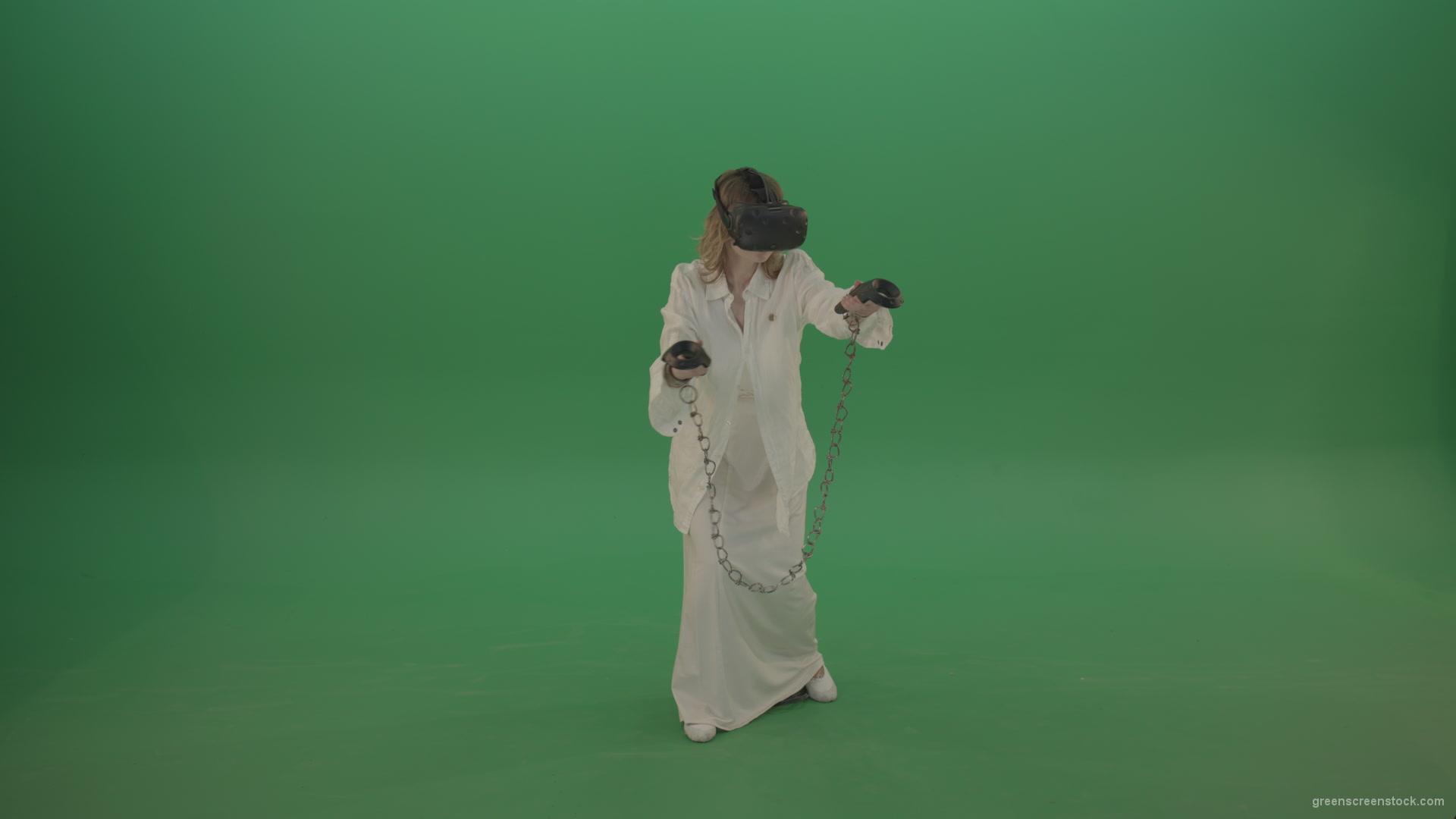 Girl-in-a-white-spacious-dress-is-wearing-glasses-of-virtual-reality-isolated-on-green-background_009 Green Screen Stock