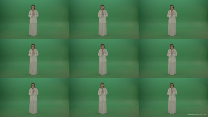Girl-wearing-a-white-suit-pray-to-god-isolated-on-green-background Green Screen Stock