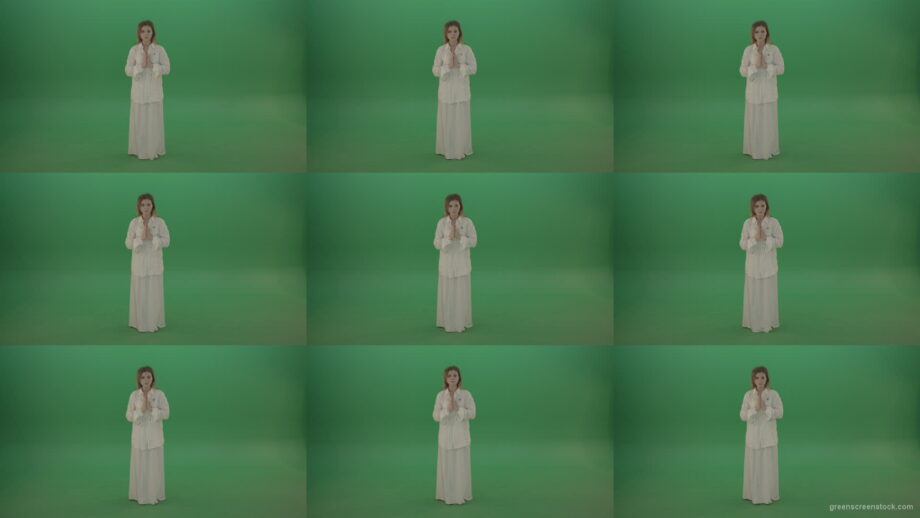 Girl-wearing-a-white-suit-pray-to-god-isolated-on-green-background Green Screen Stock