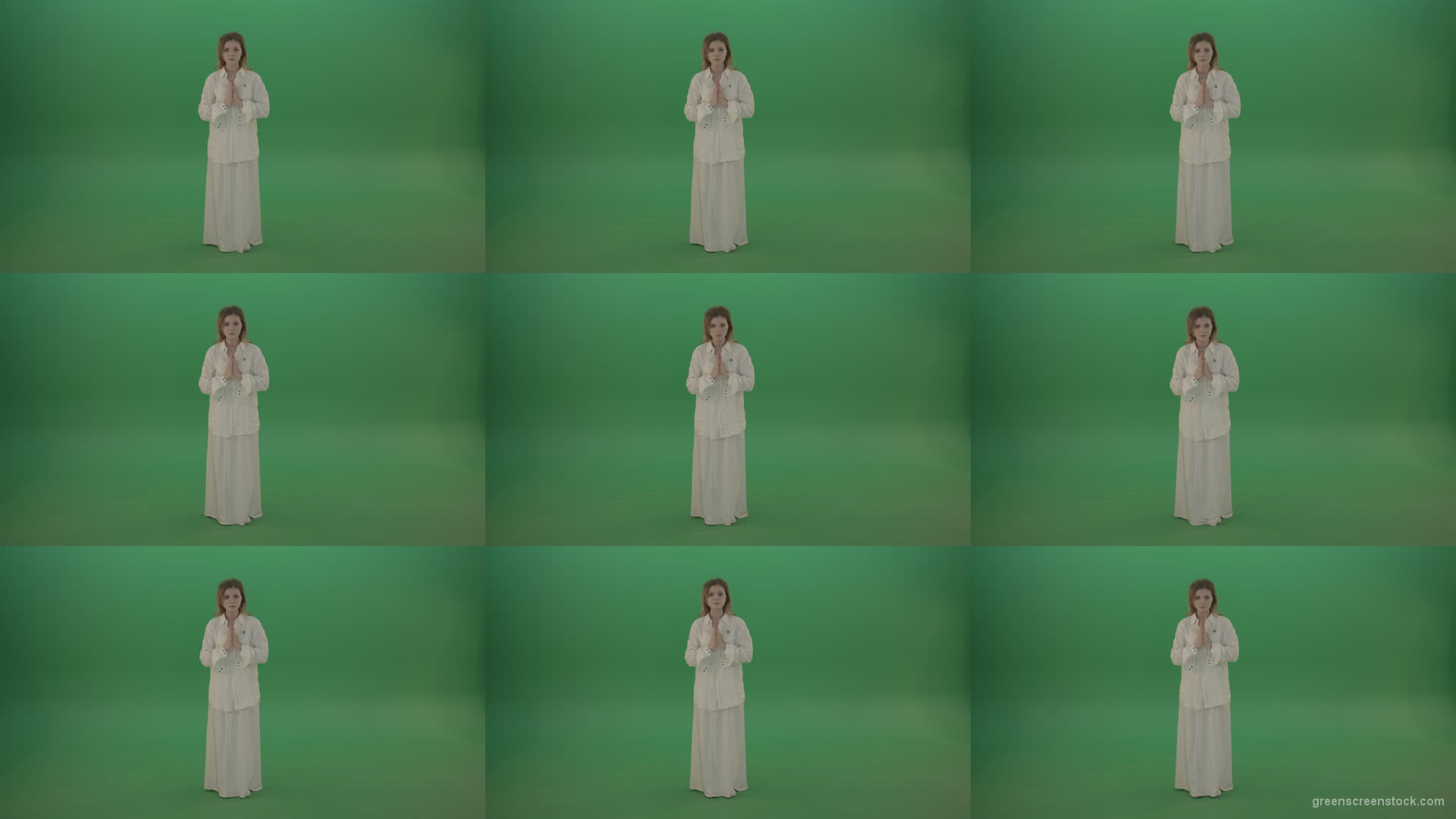 Girl-wearing-a-white-suit-pray-to-god-isolated-on-green-background Green Screen Stock