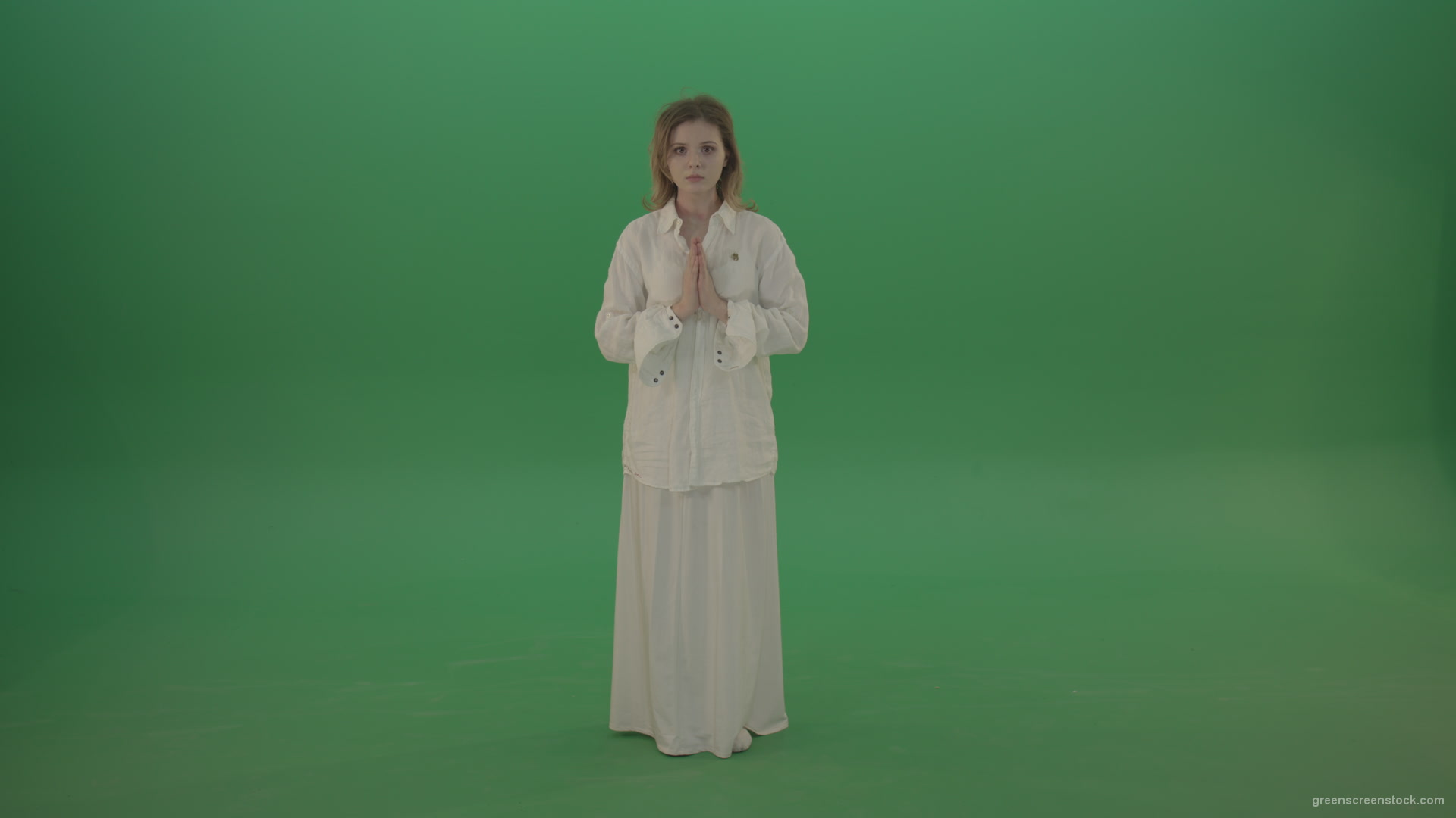 Girl-wearing-a-white-suit-pray-to-god-isolated-on-green-background_001 Green Screen Stock