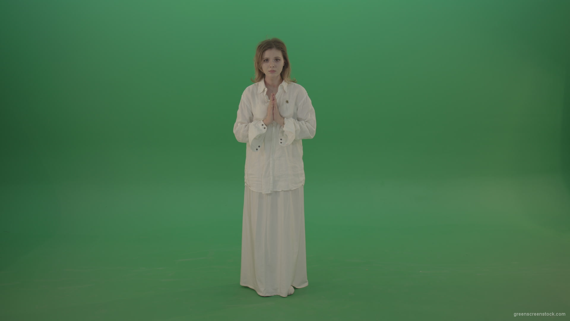 Girl-wearing-a-white-suit-pray-to-god-isolated-on-green-background_004 Green Screen Stock