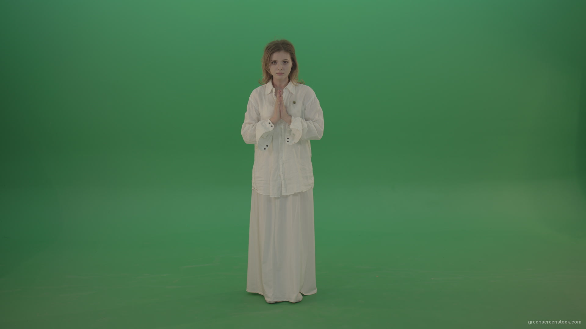 Girl-wearing-a-white-suit-pray-to-god-isolated-on-green-background_009 Green Screen Stock