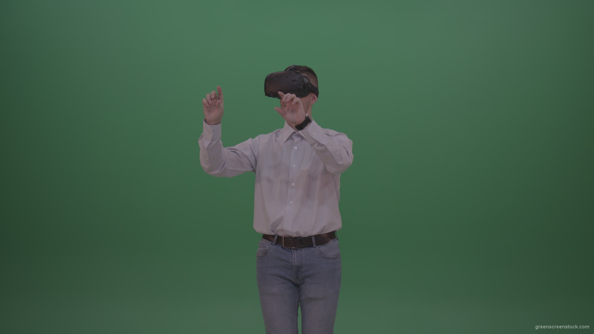 Young_Handsome_Man_With_Black_Hair_Wearing_White_Shirt_Using_Virtual_Glasses_Clicking_Touch_Pad_On_Green_Screen_Background_Wall_006 Green Screen Stock