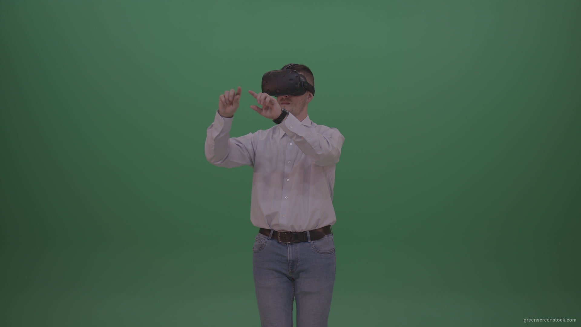 Young_Handsome_Man_With_Black_Hair_Wearing_White_Shirt_Using_Virtual_Glasses_Clicking_Touch_Pad_On_Green_Screen_Background_Wall_008 Green Screen Stock
