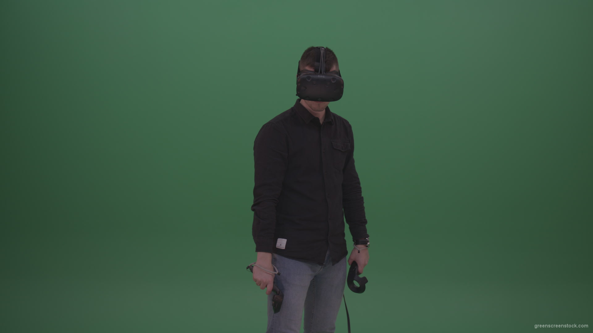 Young_Dangerous_Brunette_Man_Wearing_Black_Shirt_Shooting_Enemies_All_Around_In_Virtual_Reality_Glasses_Green_Screen_Wall_Background_001 Green Screen Stock