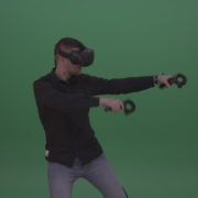 Young_Dangerous_Brunette_Man_Wearing_Black_Shirt_Shooting_Enemies_All_Around_In_Virtual_Reality_Glasses_Green_Screen_Wall_Background_004 Green Screen Stock