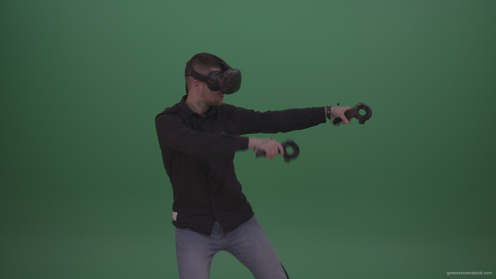 Young_Dangerous_Brunette_Man_Wearing_Black_Shirt_Shooting_Enemies_All_Around_In_Virtual_Reality_Glasses_Green_Screen_Wall_Background_004 Green Screen Stock
