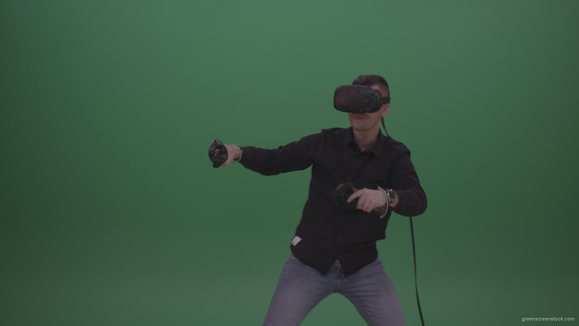 Young_Dangerous_Brunette_Man_Wearing_Black_Shirt_Shooting_Enemies_All_Around_In_Virtual_Reality_Glasses_Green_Screen_Wall_Background_009 Green Screen Stock
