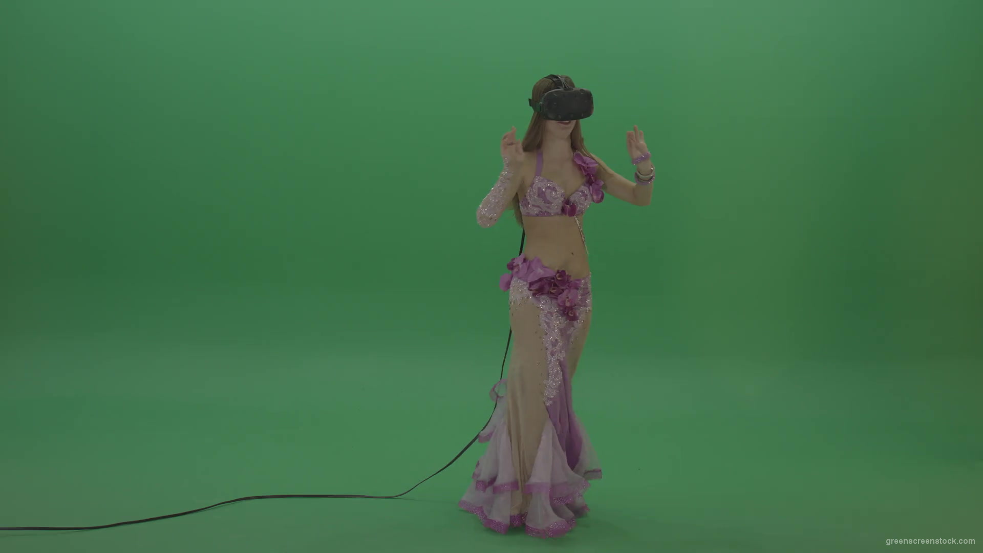 Beautiful-belly-dancer-in-purple-wear-and-VR-headset-dances-over-green-screen-background-1920_004 Green Screen Stock