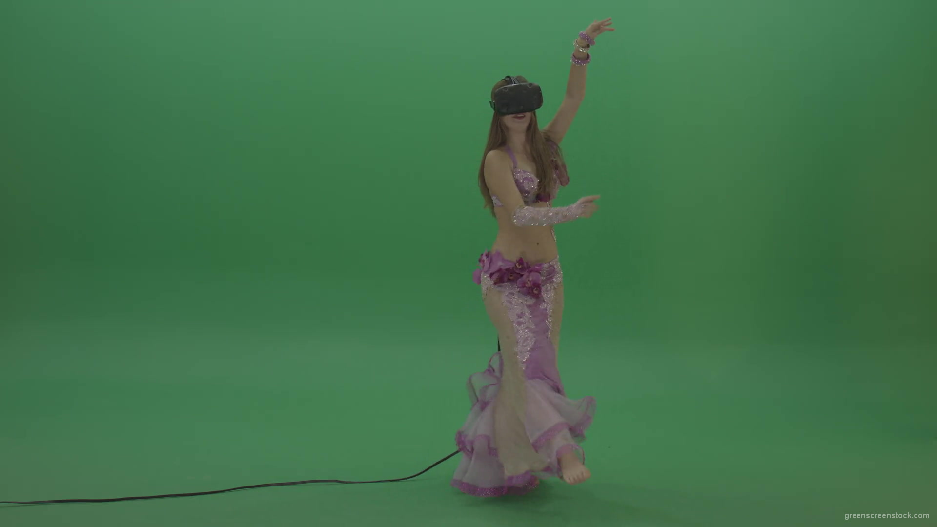 Beautiful-belly-dancer-in-purple-wear-and-VR-headset-dances-over-green-screen-background-1920_006 Green Screen Stock