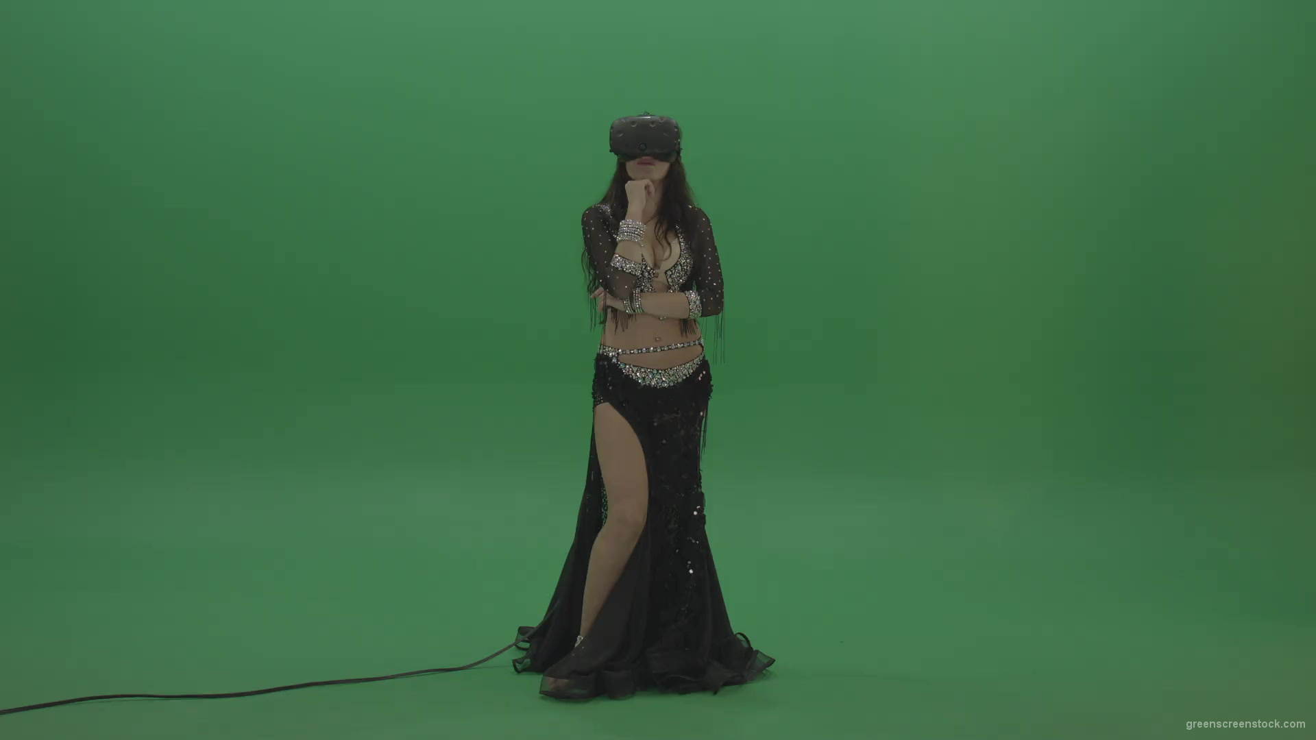 Beautiful-belly-dancer-in-VR-headset-operates-invisible-screen-over-green-screen-background-1920_001 Green Screen Stock