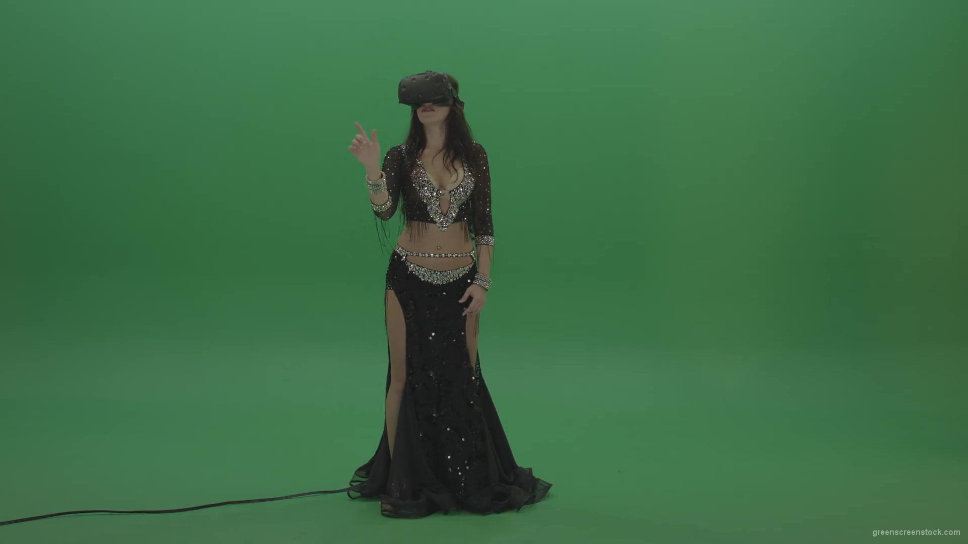 Beautiful-belly-dancer-in-VR-headset-operates-invisible-screen-over-green-screen-background-1920_004 Green Screen Stock